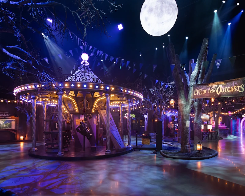 A full moon lights up the Wednesday themed carnival.