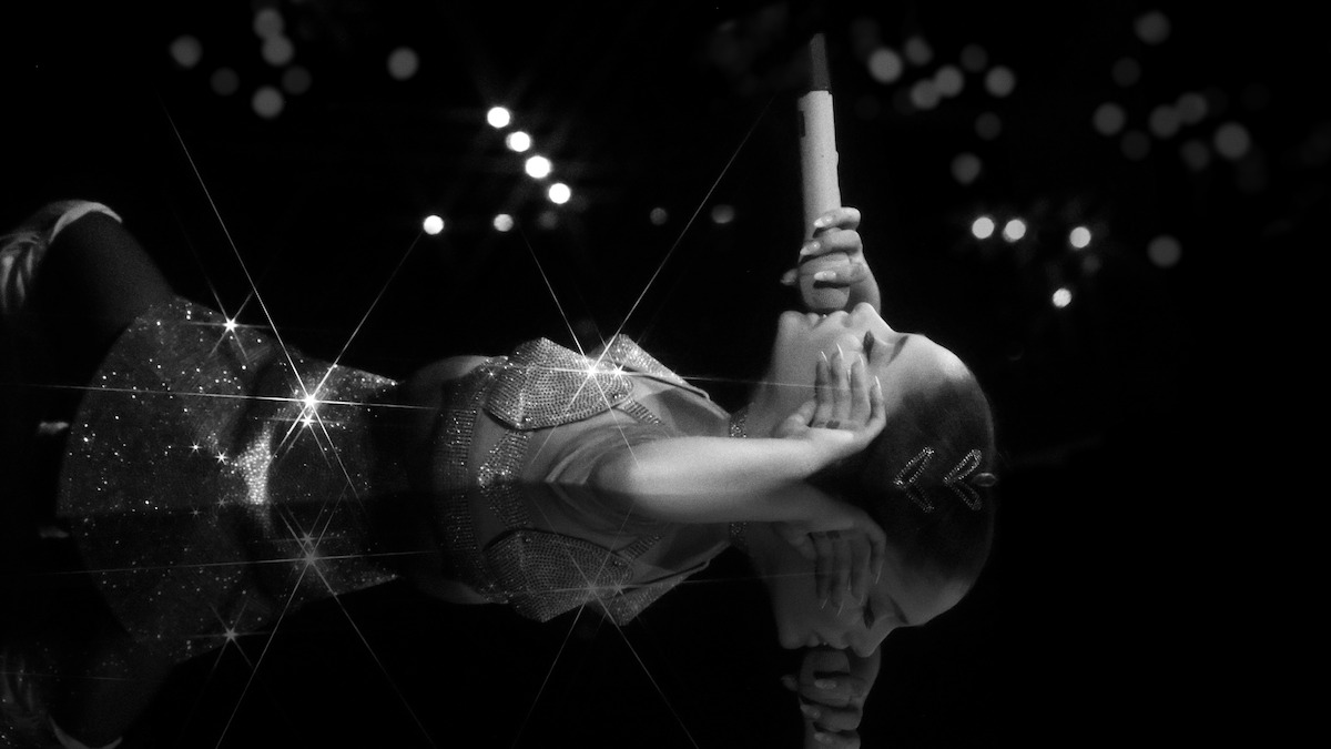 Ariana Grande singing in ‘ariana grande: excuse me, i love you.’