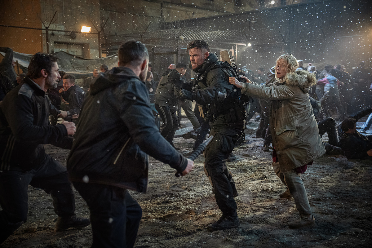 Chris Hemsworth as Tyler Rake and Tinatin Dalakishvili as Ketevan.