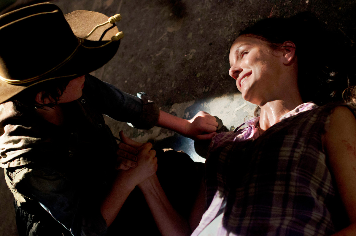 Lori lying on the ground, looking hurt. 