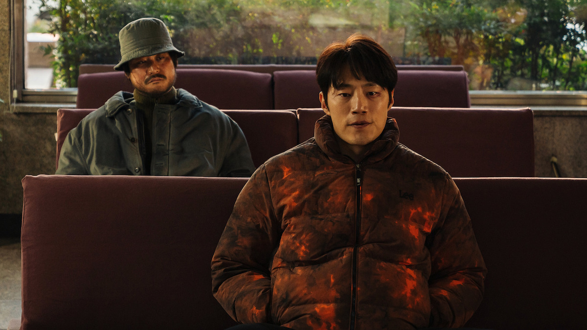  Kim Sung-kyun sits behind Lee Hee-jun in an image from the series 'Karma.'