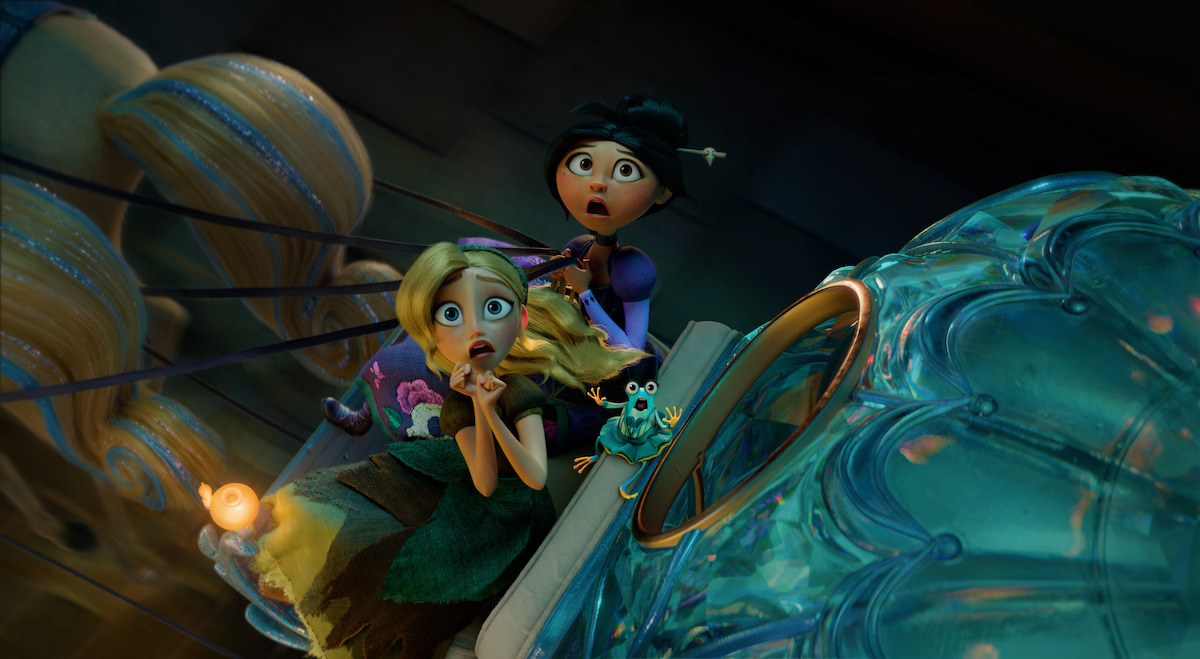 Two animated girls and a chameleon look surprised while riding a flying glass object inside a fantastical, creatively lit environment.