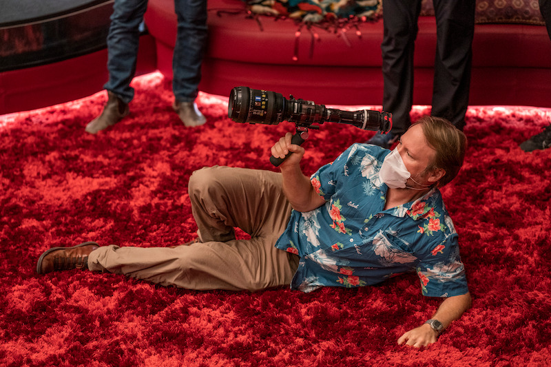 Johnson snags a shot — and checks to make sure the carpet is soft enough. 