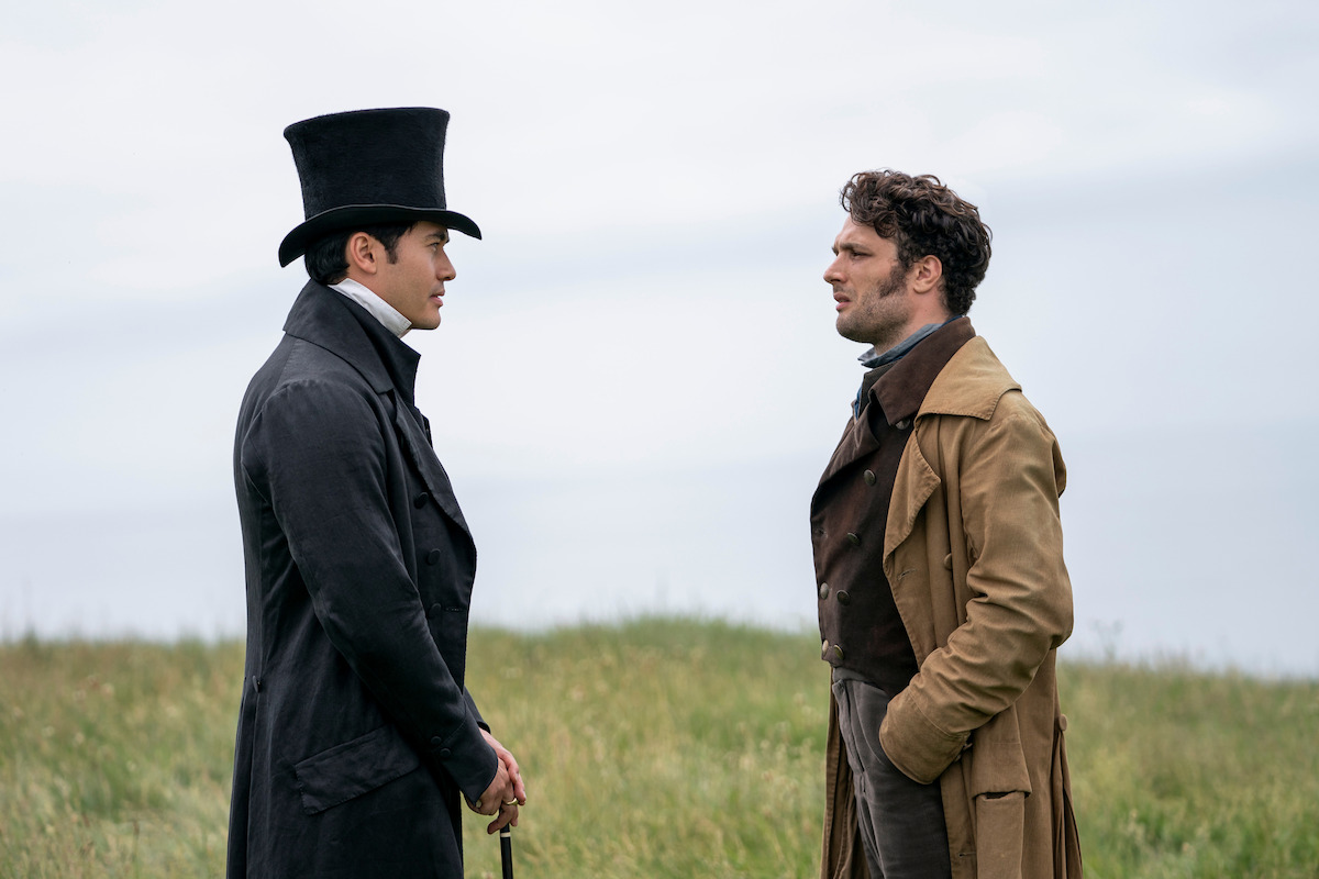 A photo of Henry Golding (left) and Cosmo Jarvis (right) - Dakota Johnson’s ‘Persuasion’ Gets a Summer Release Date