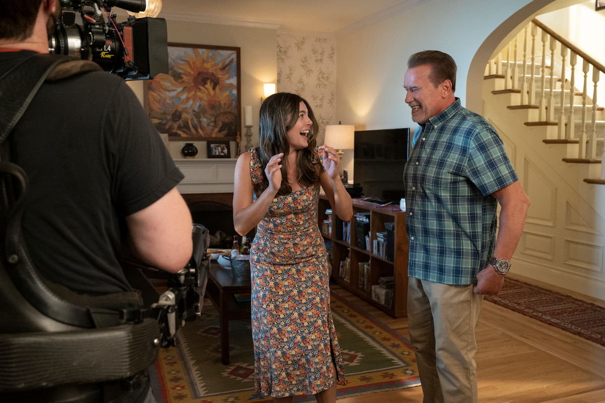 Monica Barbaro as Emma Brunner and Arnold Schwarzenegger as Luke Brunner behind the scenes on the set of ‘FUBAR’ Season 1.