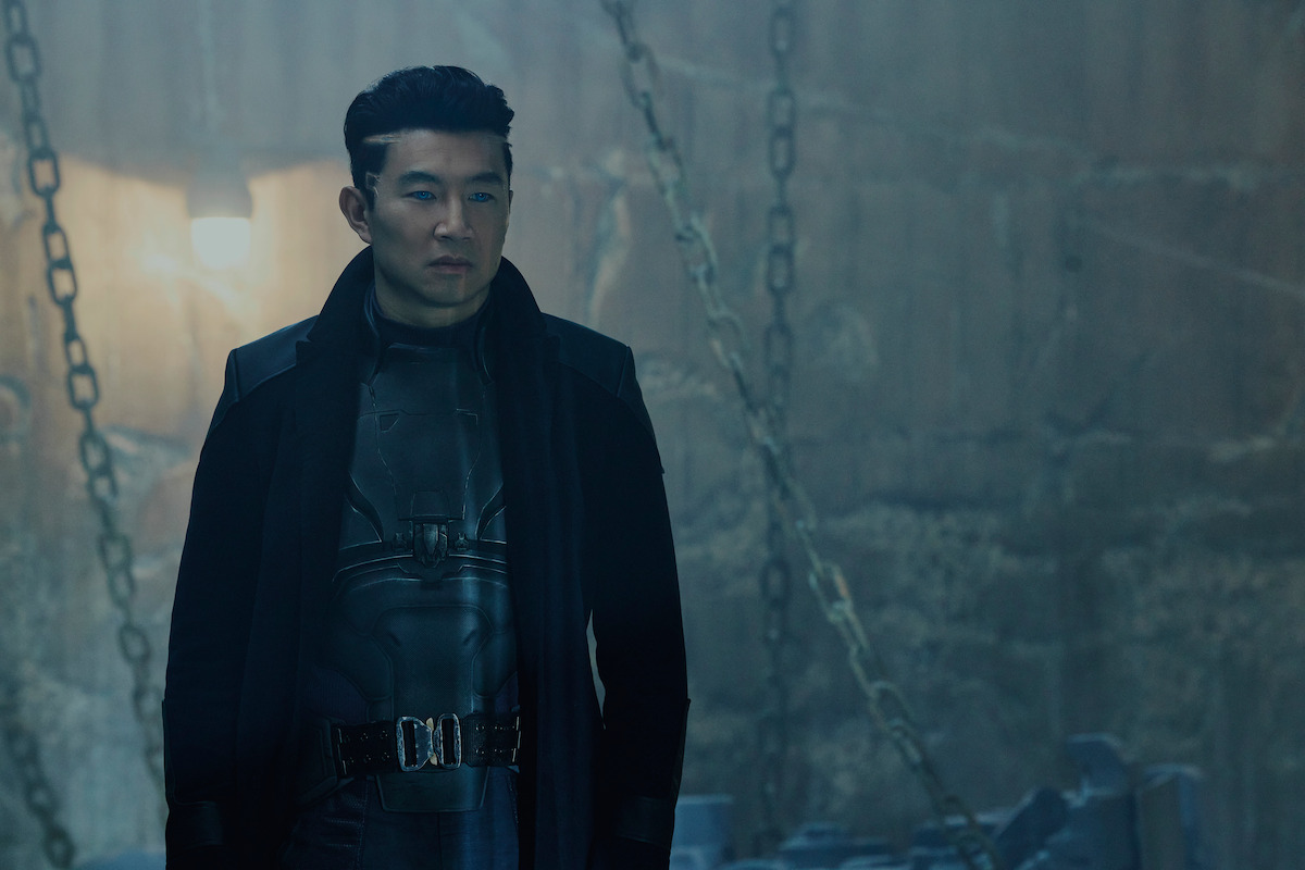Simu Liu as Harlan looks off into the distance in ‘Atlas.’