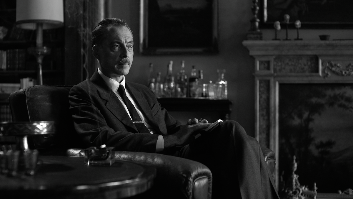 Maurizio Lombardi as Inspector Ravini sits in a chair in an ornate room in ‘Ripley’