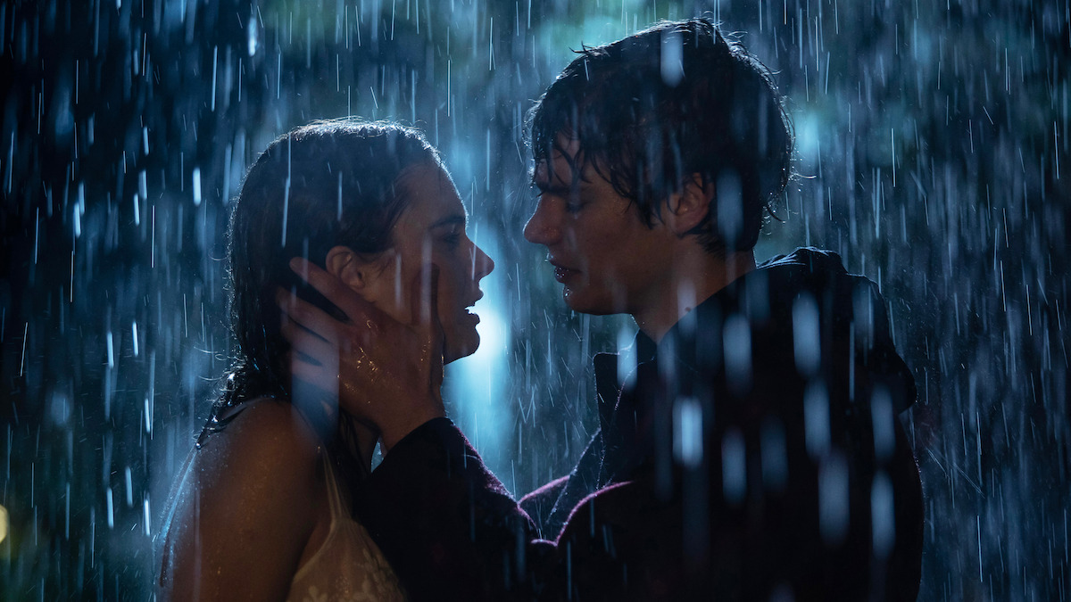 Caterina Ferioli as Nica and Simone Baldasseroni as Riguel kiss in the rain in ‘The Tearsmith’