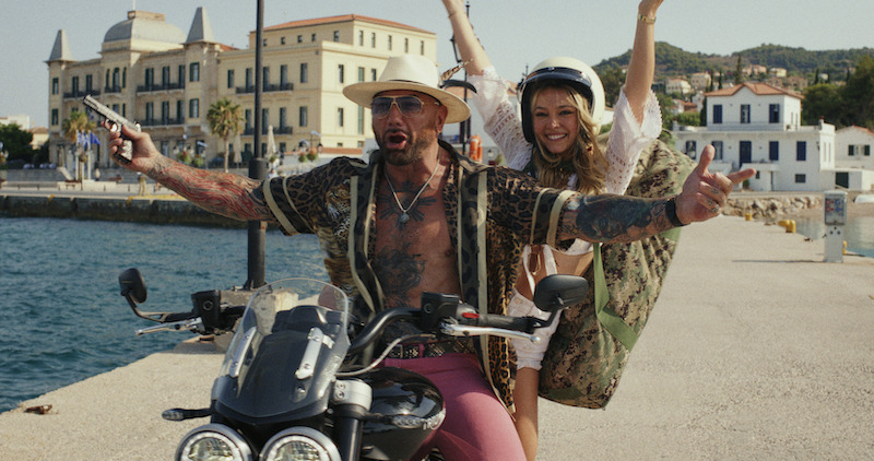 Dave Bautista and Madelyn Cline make their grand entrance.