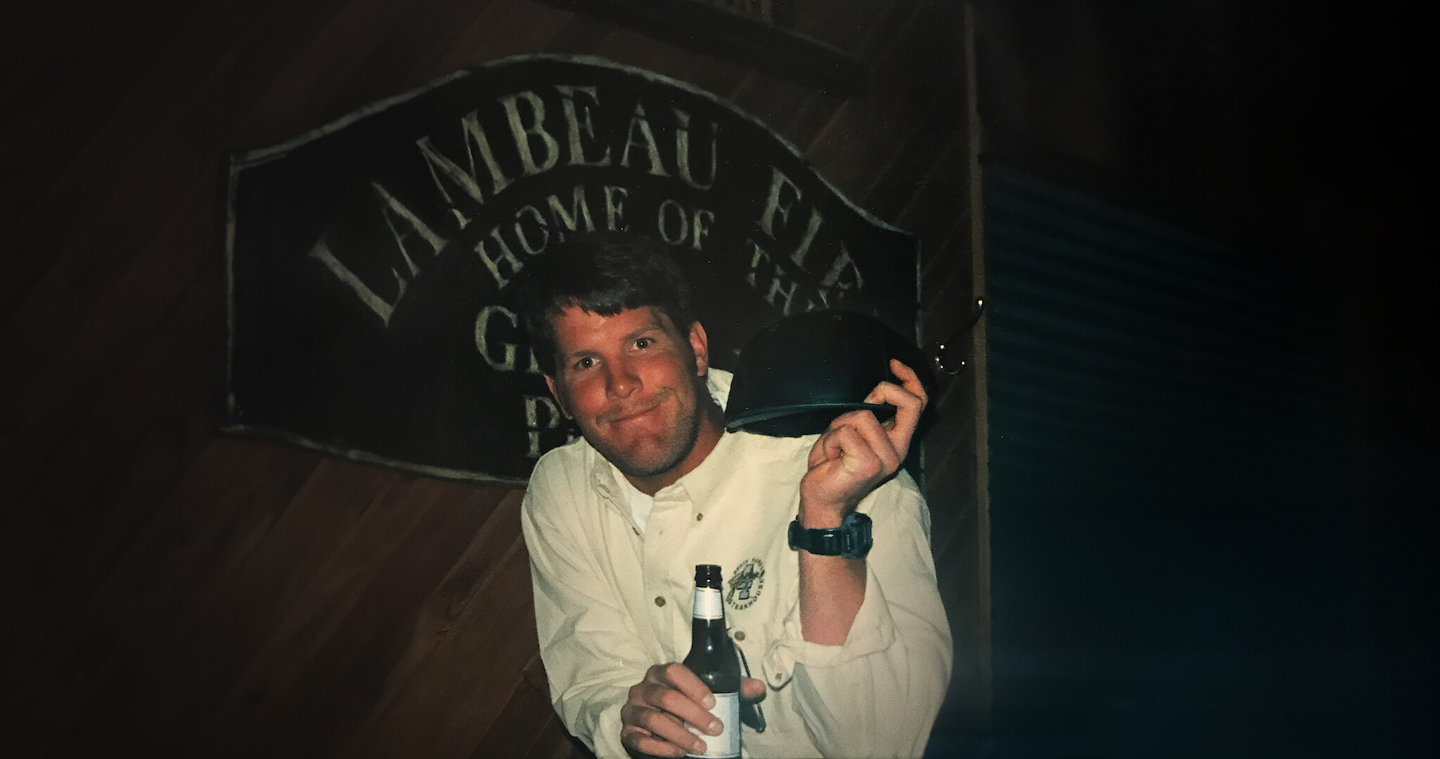 Untold: The Fall of Favre - Brett Farve as a young quarterback in a bar holding a beer.