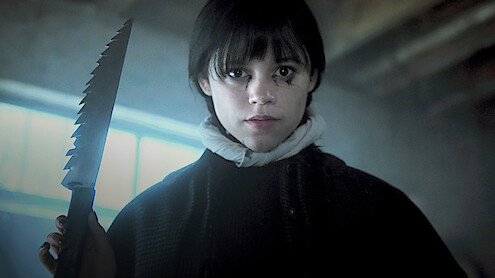 Jenna Ortega as Wednesday Addams holds a large knife in 'Wednesday' Season 2