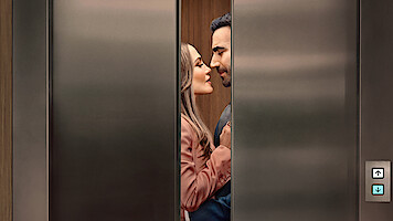 A couple standing close together inside an elevator, gazing at each other affectionately as the stainless steel elevator doors partially close, suggesting a romantic or intimate moment in a modern building setting.