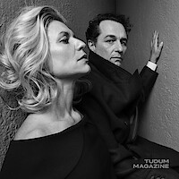 Claire Danes and Matthew Rhys pose for the camera wearing all black.