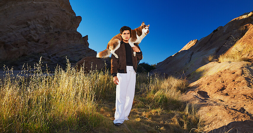 Charles Melton poses.