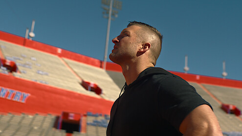 Tim Tebow looking around Ben Hill Griffin Stadium.