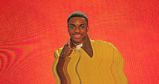 Vince Staples smiles with a screen distortion over the image