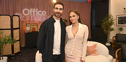 Brett Goldstein poses next Jennifer Lopez at speed dating event.