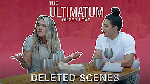 Dayna and Magan seated at a wooden table with metallic cups against a red background. The text reads: 'The Ultimatum: Queer Love – Deleted Scenes.'